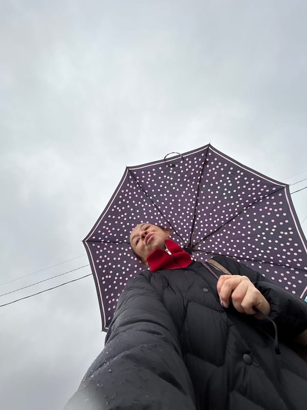Rainy morning scene captured with umbrella in Chaikovsky, Russia