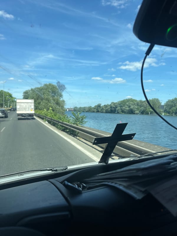 Highway traffic observed alongside river in Argenteuil, France
