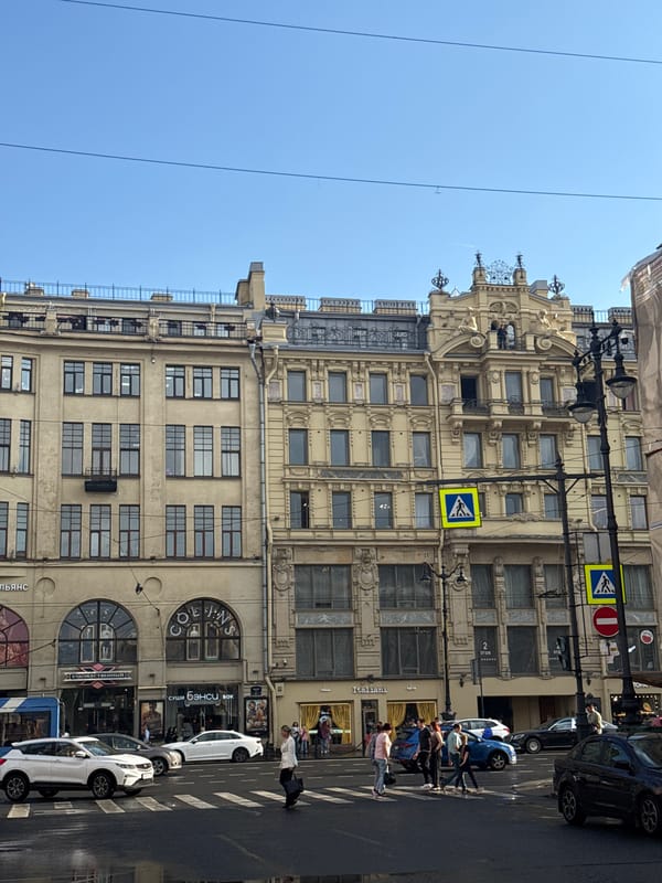 Rain-soaked afternoon unfolds along Saint Petersburg's Nevsky Prospekt