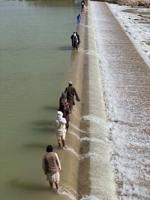 Groups gather at river dam in Kim, Afghanistan