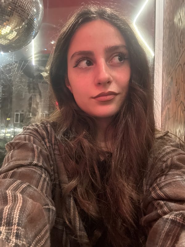 Woman enjoys coffee and selfies at Yerevan cafe
