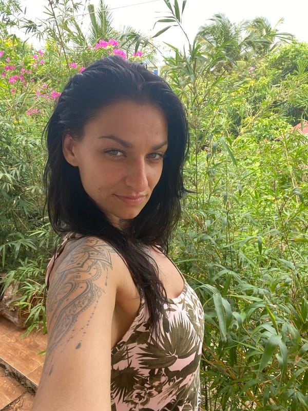 Woman takes morning selfies in tropical Mũi Né setting