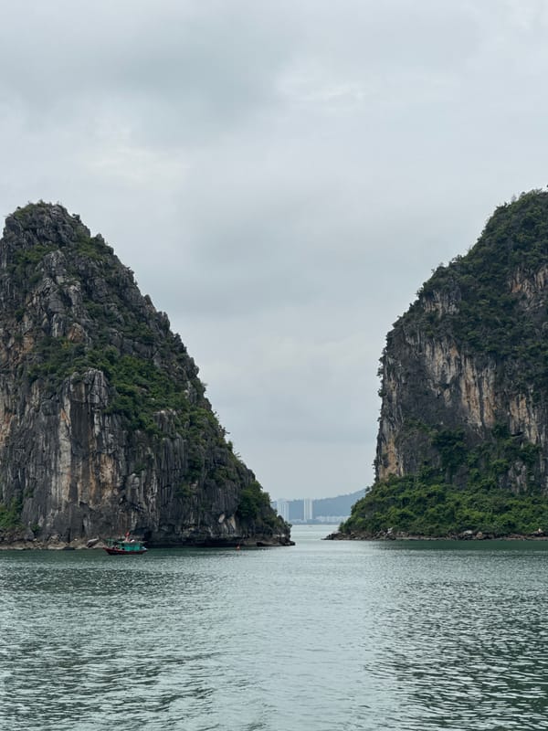 Boats navigating Ha Long Bay's karst-lined waters