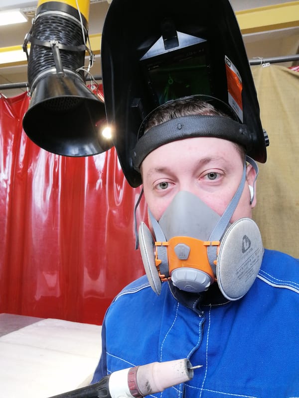 Worker in safety gear observed at welding workshop