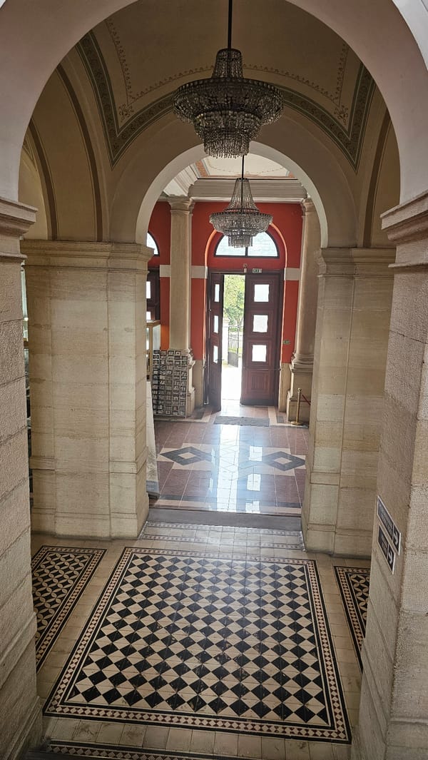 Visitor documents ornate interior of Varna Archaeological Museum