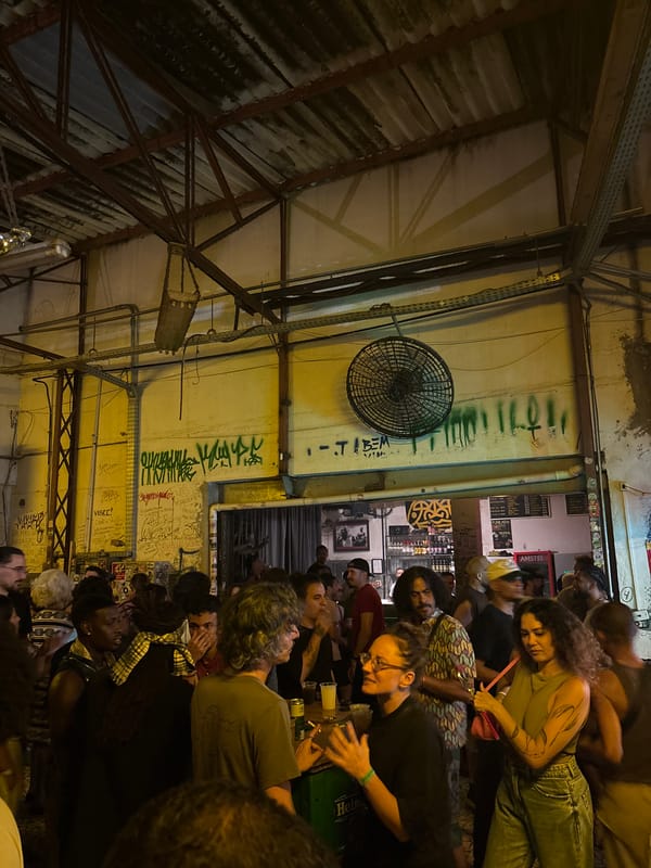 Late-night club scene with live band, DJ performance in São Paulo