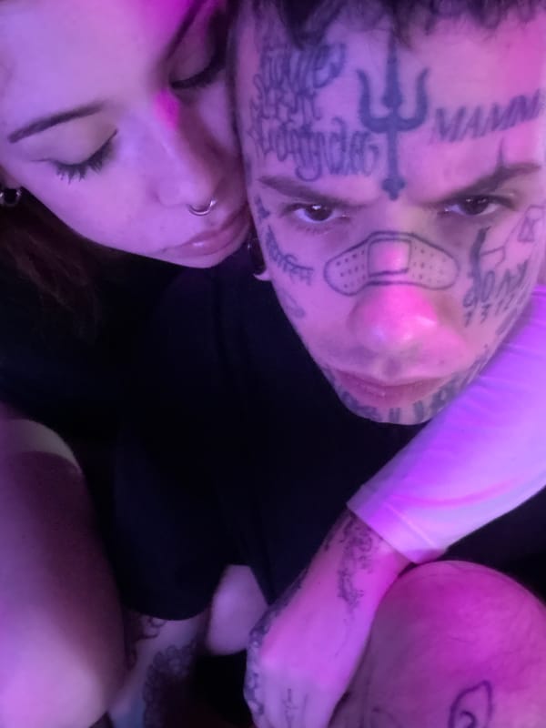 Two people observed under purple light in Buenos Aires