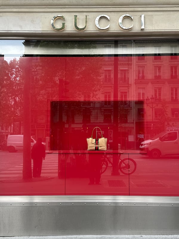 Gucci store exterior observed in Paris morning hours