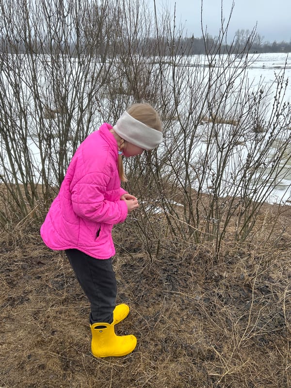 Child explores flood damage in rural Russian village