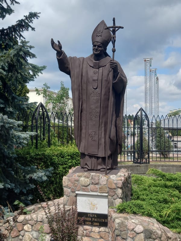 Bees on lavender and a papal statue in a Brest park