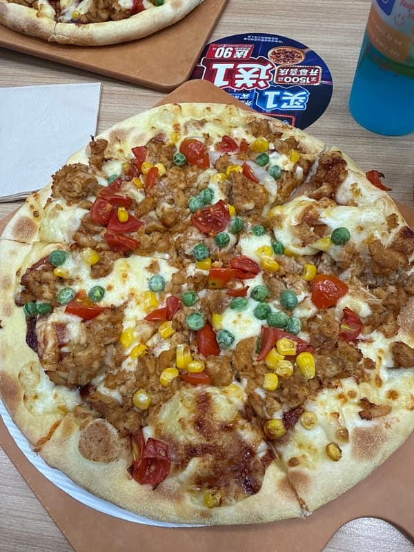 Morning pizza meal documented in Beijing's Dongcheng District