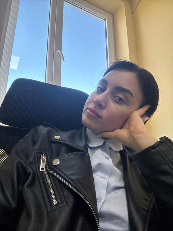 Woman in leather jacket observed in Tbilisi office