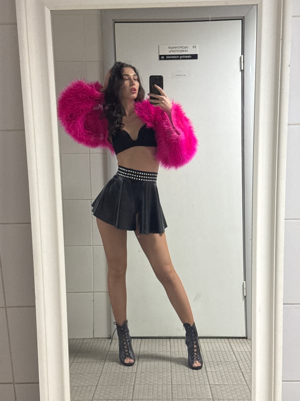 Woman takes mirror selfies in Kazan public restroom