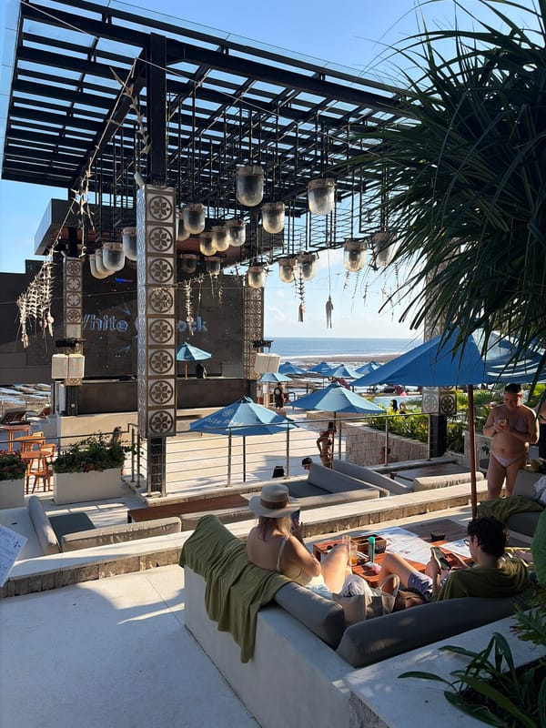 Daytime beach club event with dancers and ocean views, Kuta Selatan