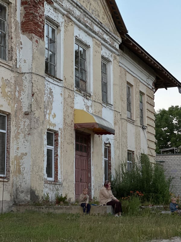Rural community gathering with bonfire and outdoor screening, Belarus