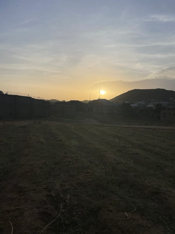 Sunset and dog interaction captured on Rukuba Road, Nigeria