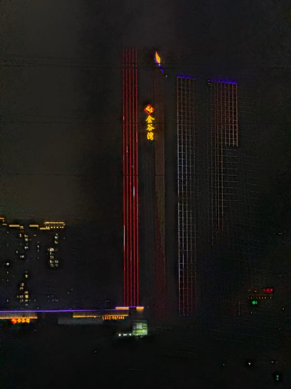 Aerial night view captures illuminated Liwan District buildings in Guangzhou