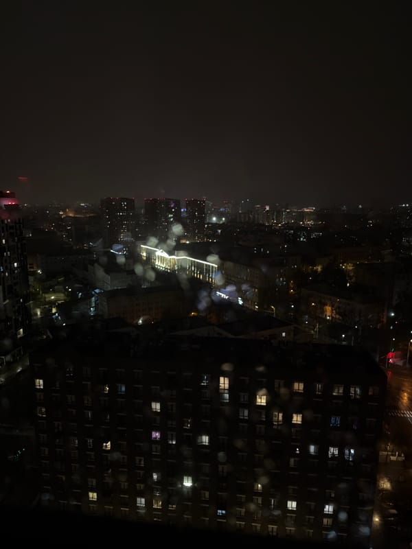Rainy night cityscape captured from aerial view