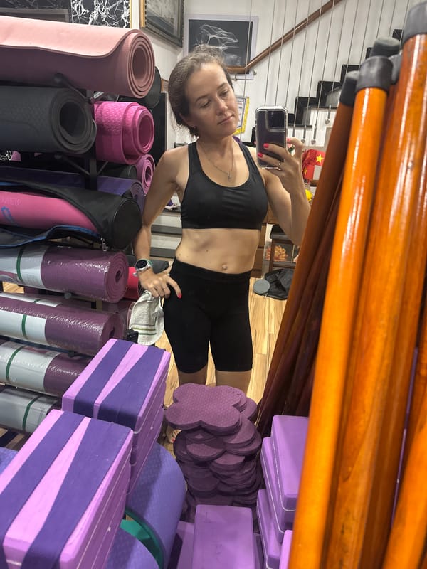 Woman takes selfies during yoga session in Vietnam studio