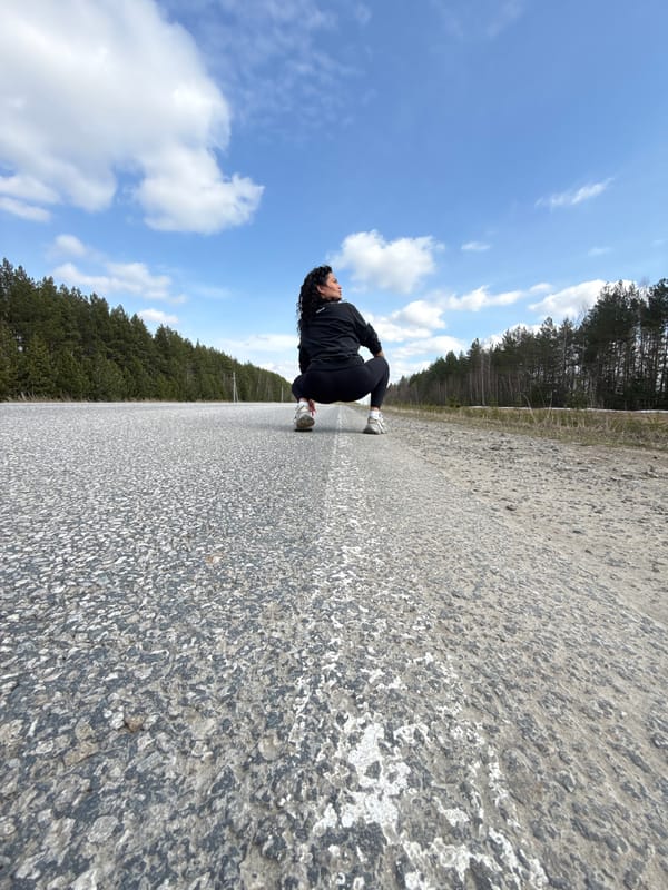 Woman poses for artistic photos on rural Russian road