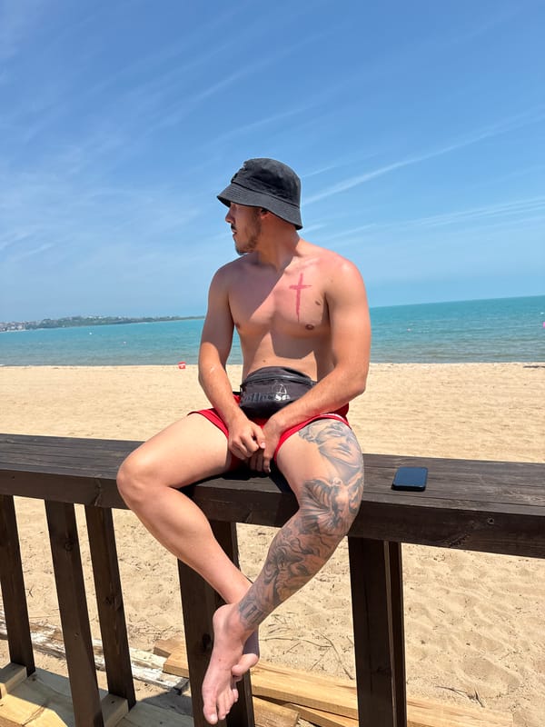 Young man enjoys morning beach visit in Sozopol, Bulgaria