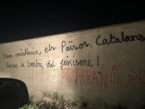 Illuminated graffiti wall photographed at night April 24