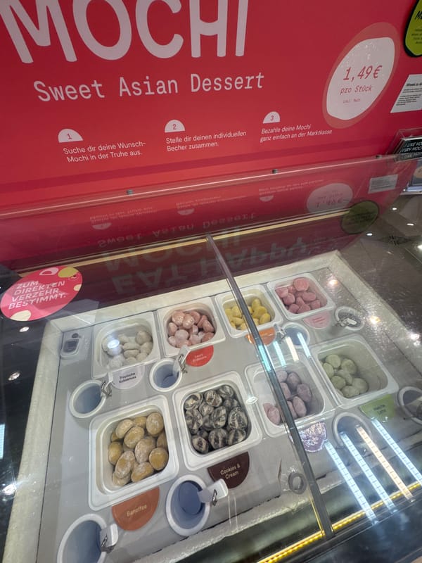 Shopper documents mochi and chocolate displays in Trier store