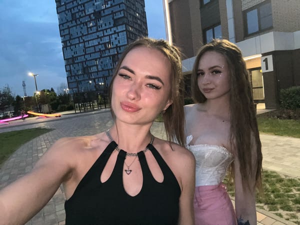 Selfie session in a black cut-out top, multiple angles