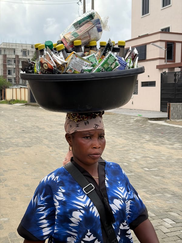 Street vendors and flowering plants in Igboefon, Nigeria