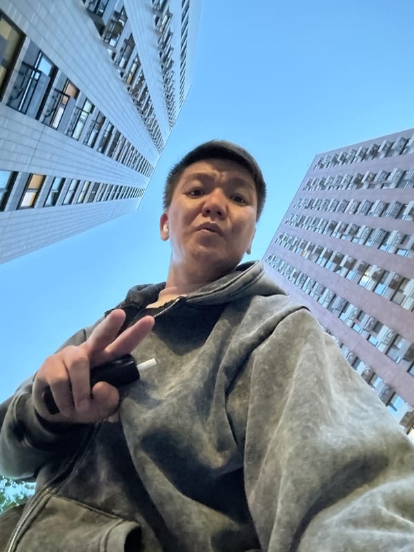Man takes selfies against Moscow skyline making peace signs