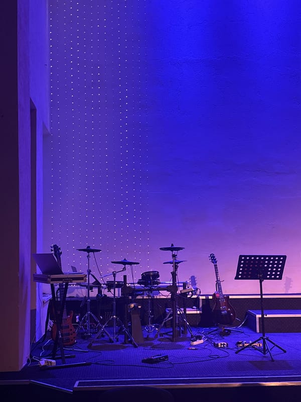 Music event underway at a lit-up indoor venue in Vitsebsk