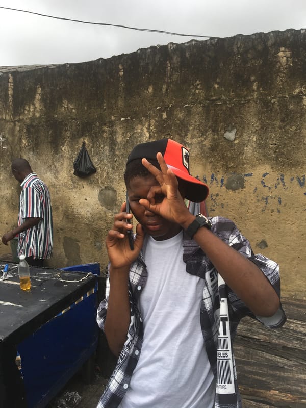 Casual morning hangout in a courtyard in Ado, Nigeria