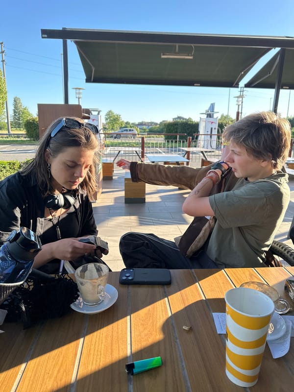Outdoor dining observed at Binasco café on clear afternoon