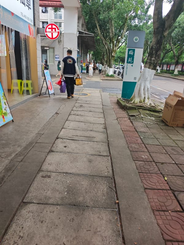 Morning sidewalk activity observed in Shapingba District, China