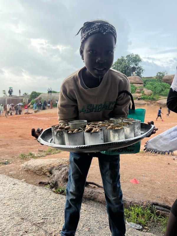 Soccer match plays on through rain in Jos, Nigeria