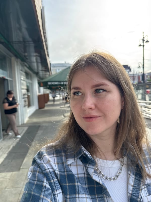 Woman takes selfies on Perm pedestrian walkway early morning