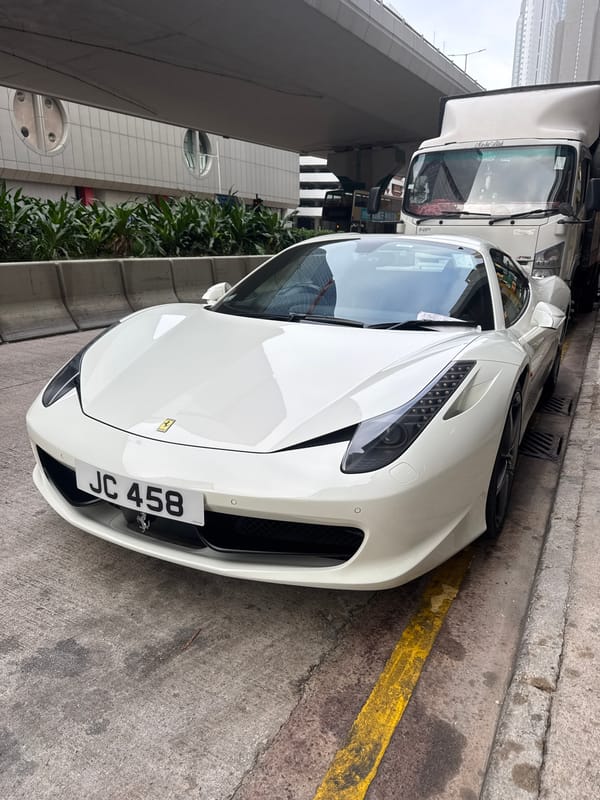 Morning street scenes captured across Hong Kong include Ferrari, tram