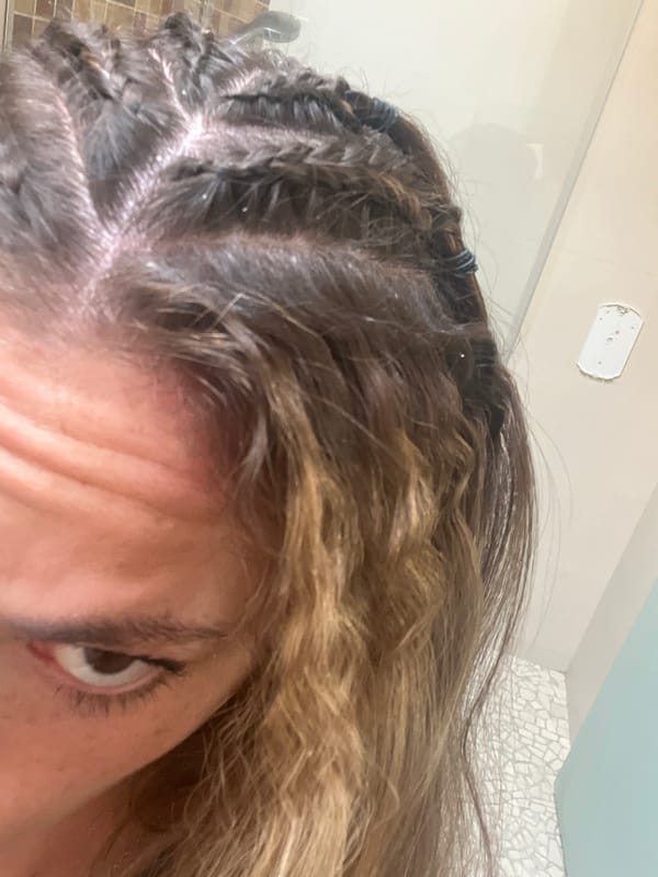 Portrait captured in San Bernardino Tlaxcalancingo shows braided hairstyle
