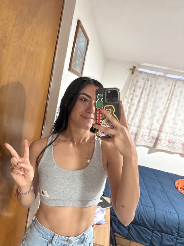 Woman takes selfies in Puebla bedroom late night
