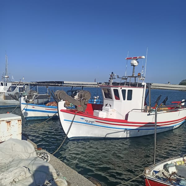 Lazy afternoon at a Greek fishing harbor