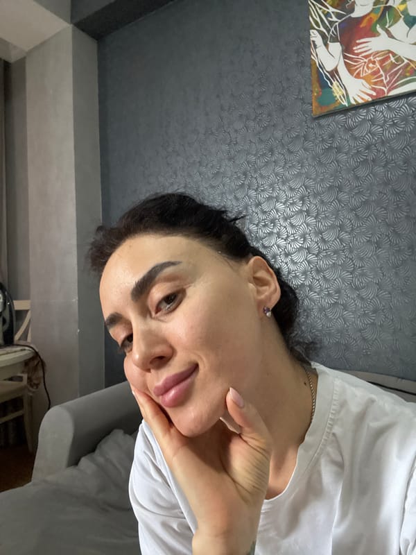 Early morning selfie session documented in Tbilisi apartment