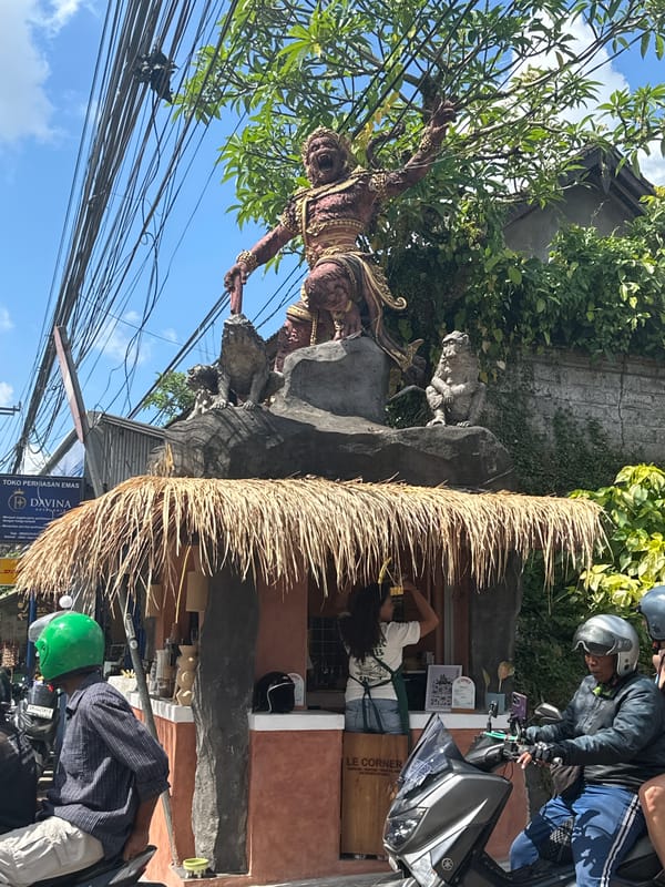 Street-level tour through Ubud's temples, traffic, and traditional decor