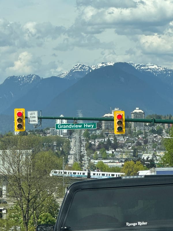 Urban Vancouver scene captured from vehicle during daytime