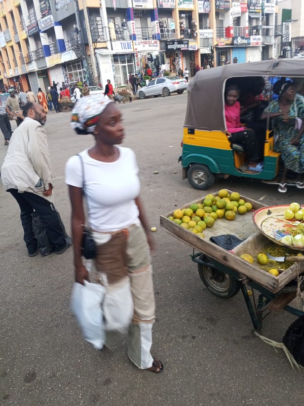 Everyday street life across Jos markets and bus stops