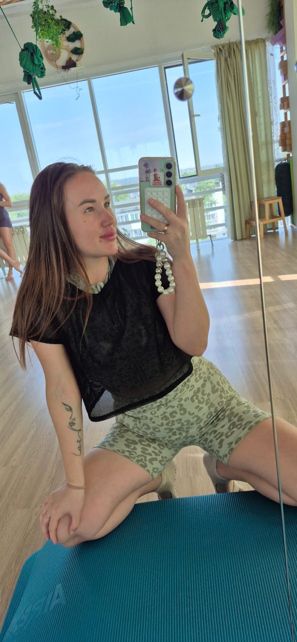 Woman documents meditation studio selfie session early morning