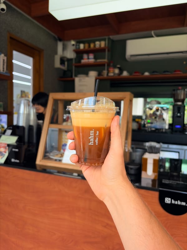 Layered drink in plastic cup, Chiang Mai morning