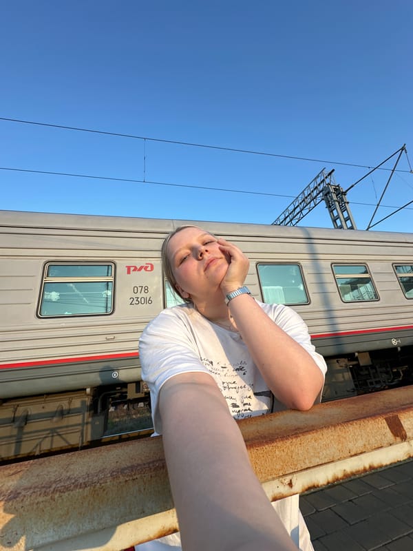 Traveler photographed at Zimovniki railway station during golden hour