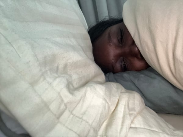 Person observed resting in bed in Dubai early morning