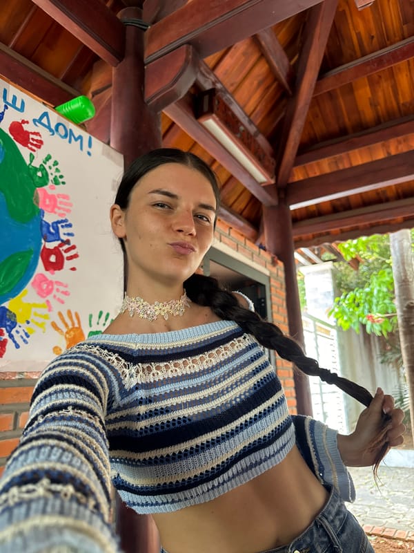 Woman's casual moments documented with child, kitten in Mũi Né