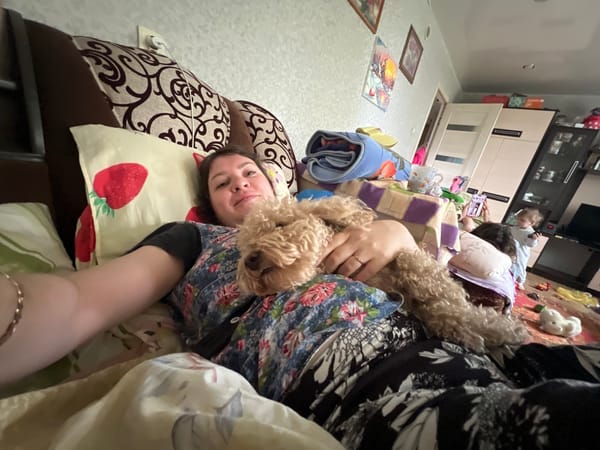 Family shares quiet morning moments with poodle in Russian home